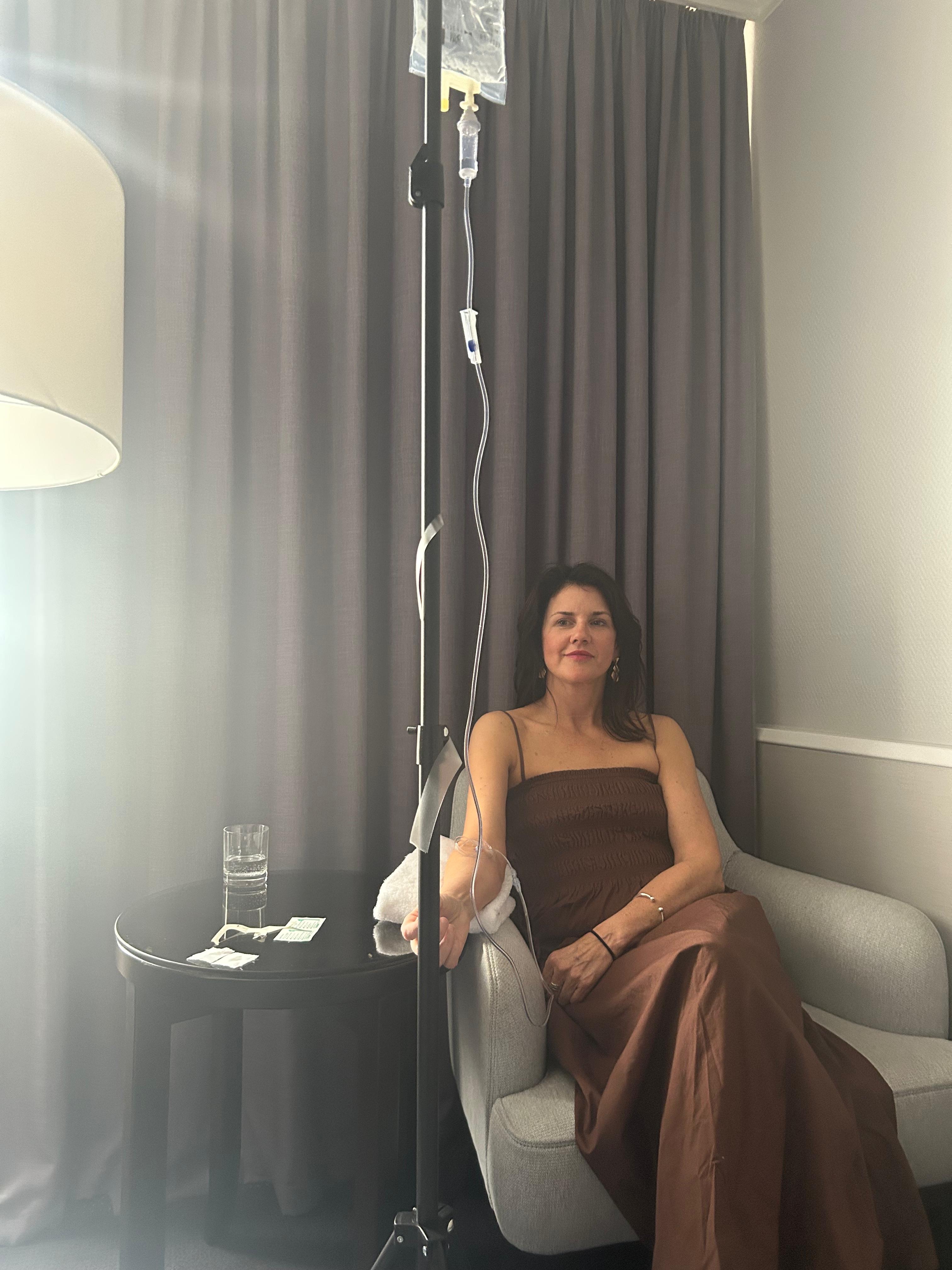 Nurse preparing IV line for IVF patient